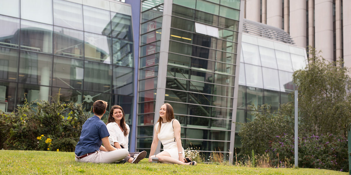 Light building image of the light building with students sitting outside