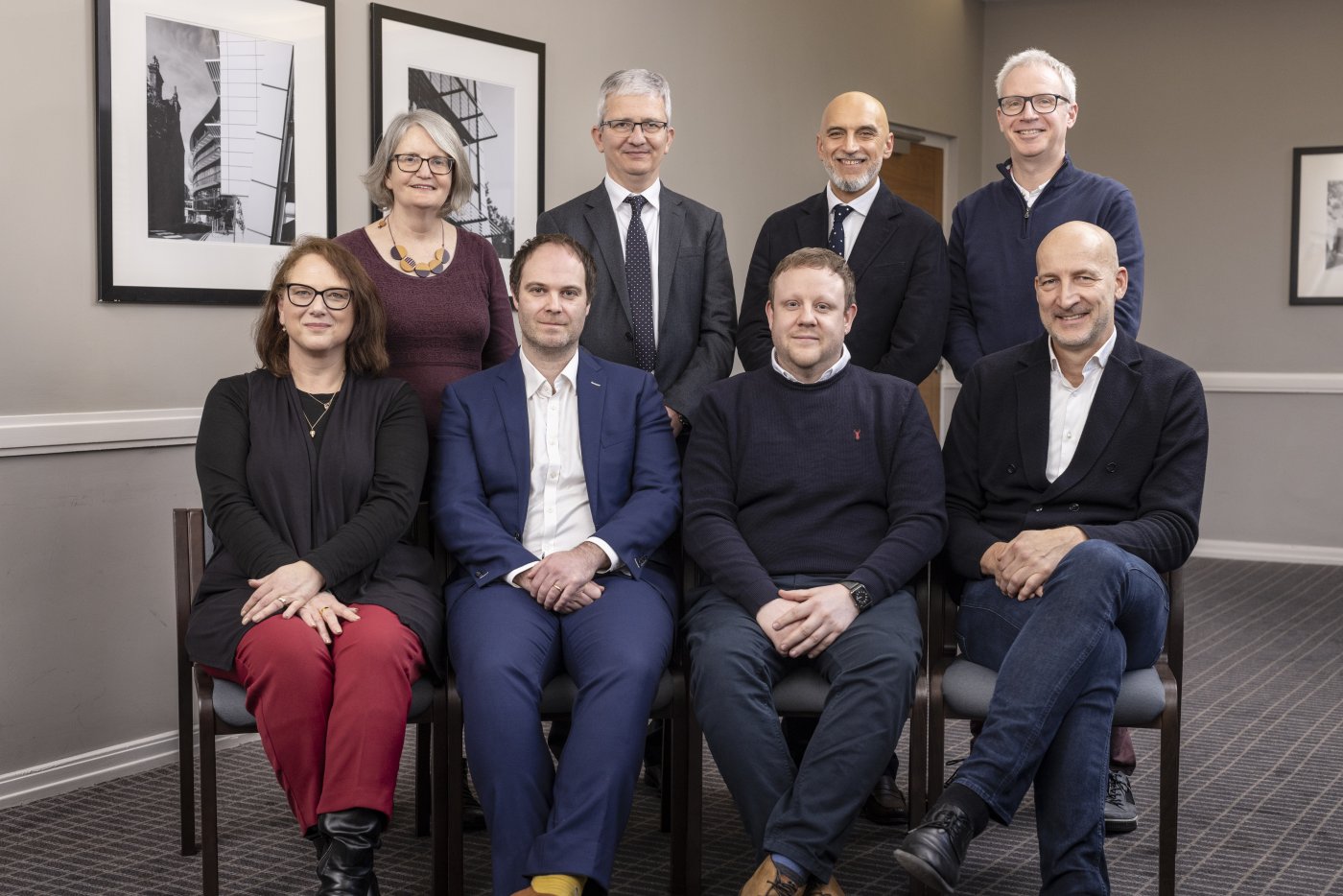 Eight members of LICAMM leadership team in two rows
