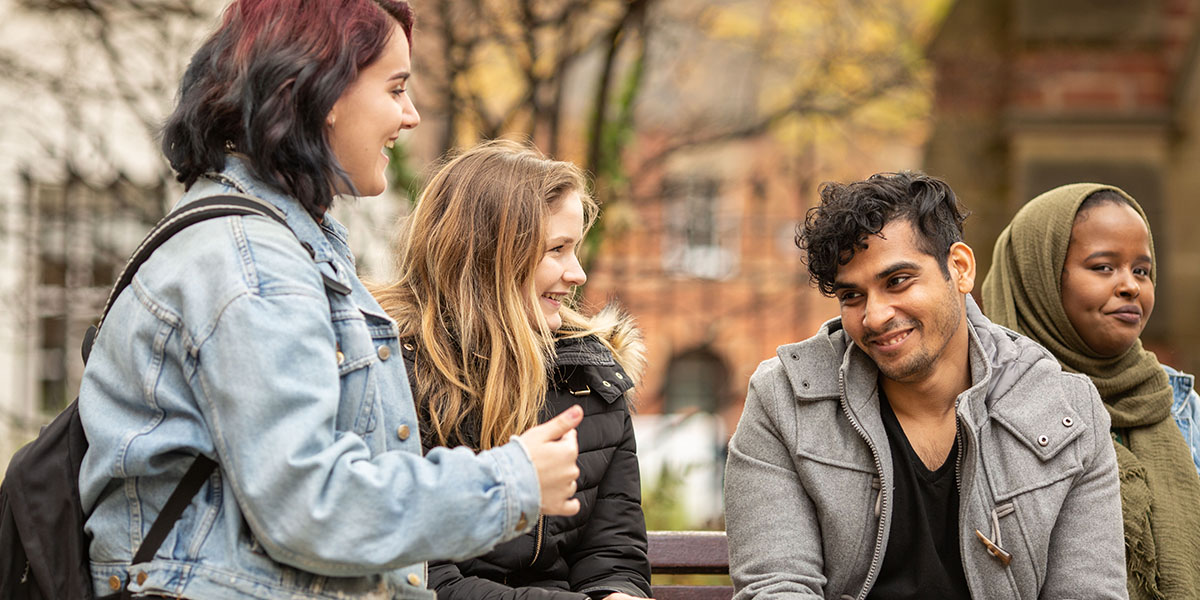 Group of University of Leeds Psychology students sat on a bench