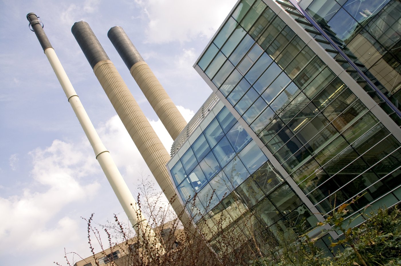 Light building taken at an angle showing chimneys