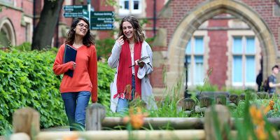 Two University of Leeds School of Healthcare students walking on campus