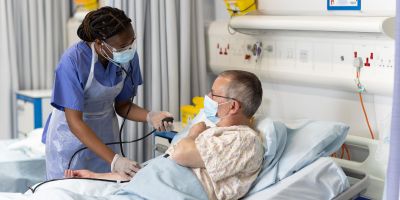 Student doctors take patient history.