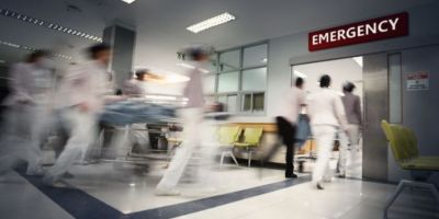 Doctors rushing into A&E with a patient on a trolley