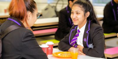 Students from Leeds City Academy enjoying their free breakfast.