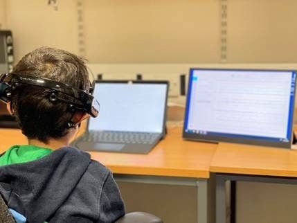 Child watching screens