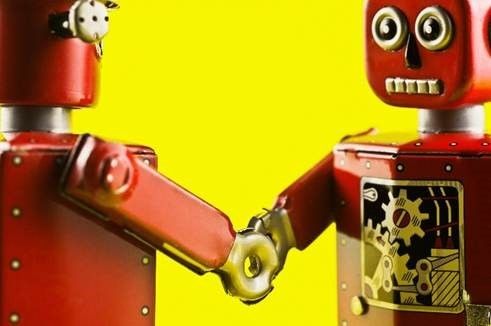 two robots shaking hands