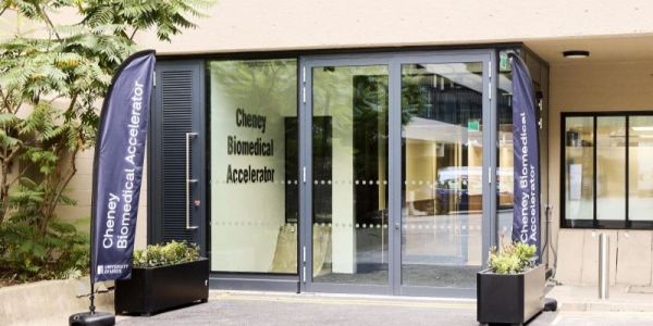 Glass entrance to Cheney biomedical accelerator exterior