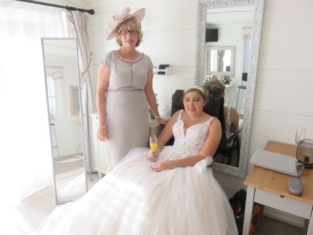 Mum standing by brain tumour patient Natalie in her wedding dress