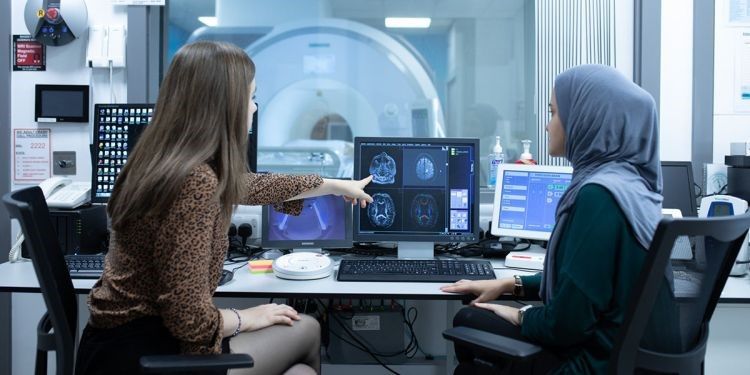 women looking at image on screen
