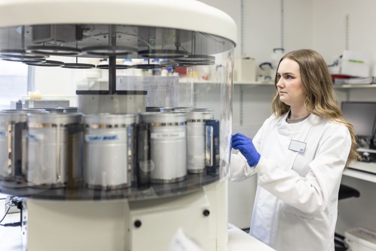 emale researcher next to equipment
