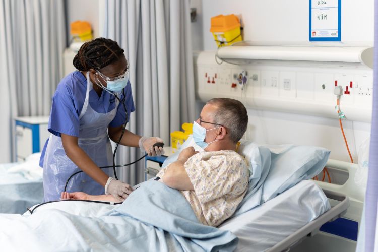 Student doctors take patient history.