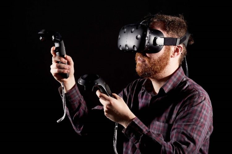 Man using HTC Vive Virtual Reality (VR) system