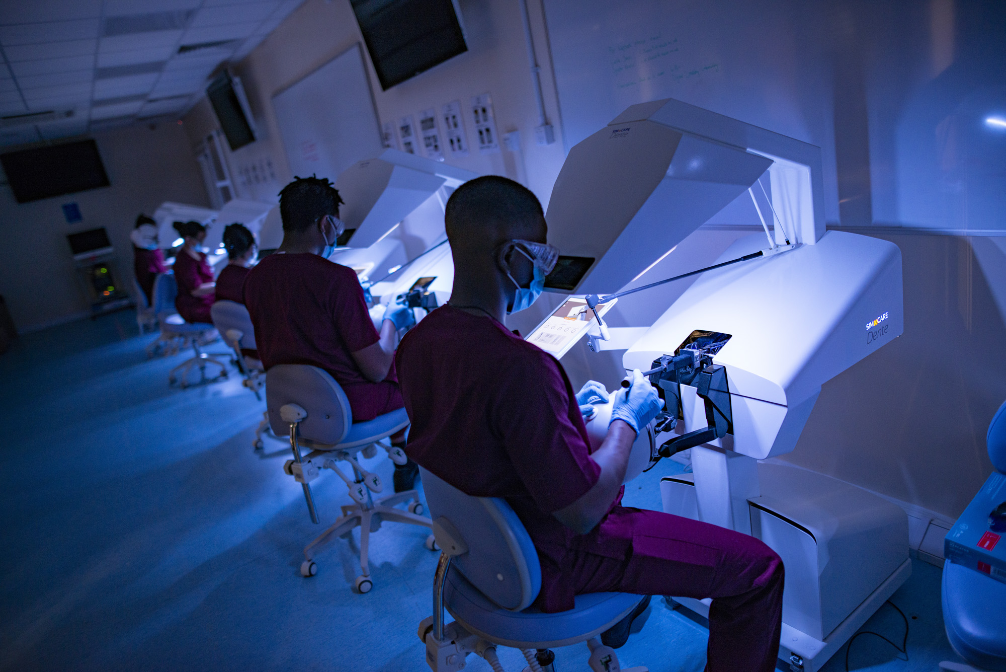Dental students using the new SimToCare haptic simulators