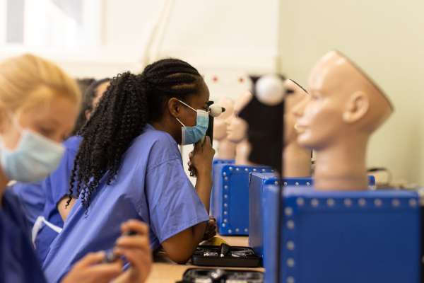 Medic student examines eyes