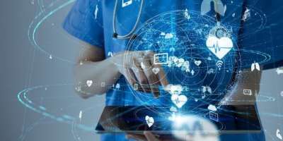 An image of a healthcare professional using a tablet device.