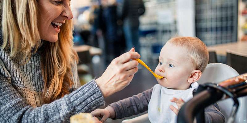 mother feeding child