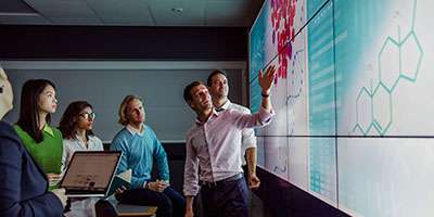 Academic pointing at research representing research and innovation at the School of Psychology