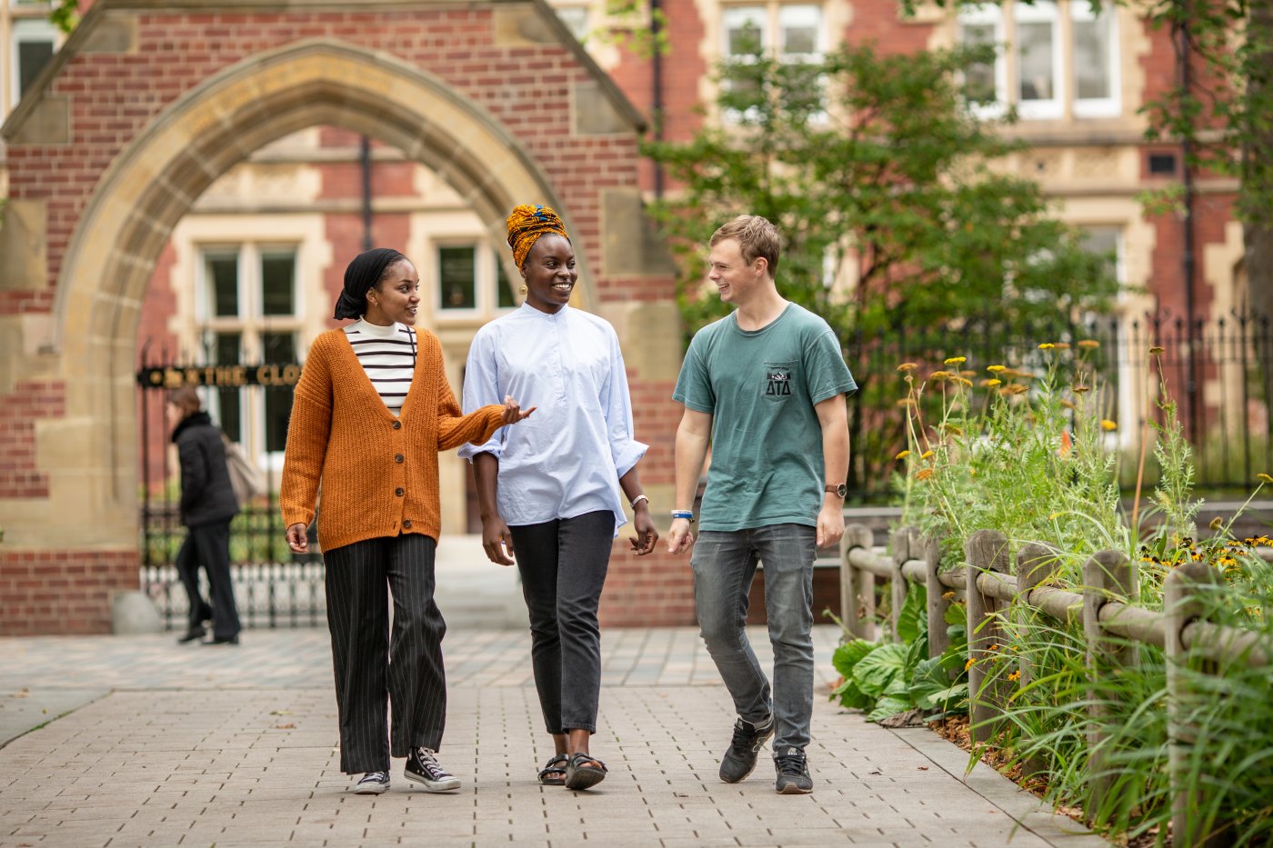 Post graduate students walking around the University of Leeds campus.
