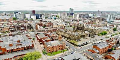 An aerial view of Leeds city centre and Leeds 
town hall
Picture free to use from Unsplash