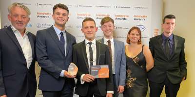 The University of Leeds, Leeds Teaching Hospitals Trust and ELAROS won the Outstanding Collaboration with Industry award at the AHSN Network and NHS Confederation Innovate Awards. 
The C19-YRS app team holding their award at the ceremony.