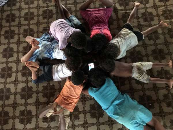 Children laying in a circle